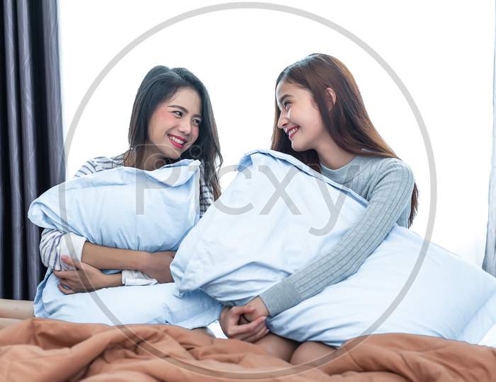 Two Asian Lesbian Looking Together In Bedroom.Beauty Concept. Happy Lifestyles And Home Sweet Home Theme. Cushion Pillow Element And Window Background. Lgbt Pride Theme.