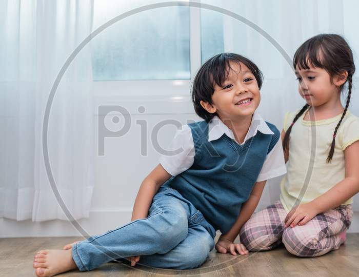 Two Caucasians Brother And Sister Portrait. Children And Kids Concept. People And Lifestyles Concept. Happy Family And Sibling Love Theme.