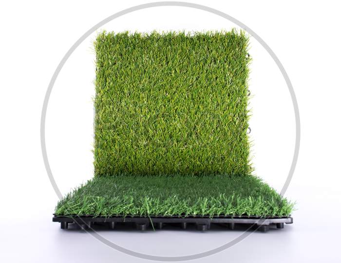 Grass Mat On White Background. Artificial Turf Tile Background. Object And Background Concept.