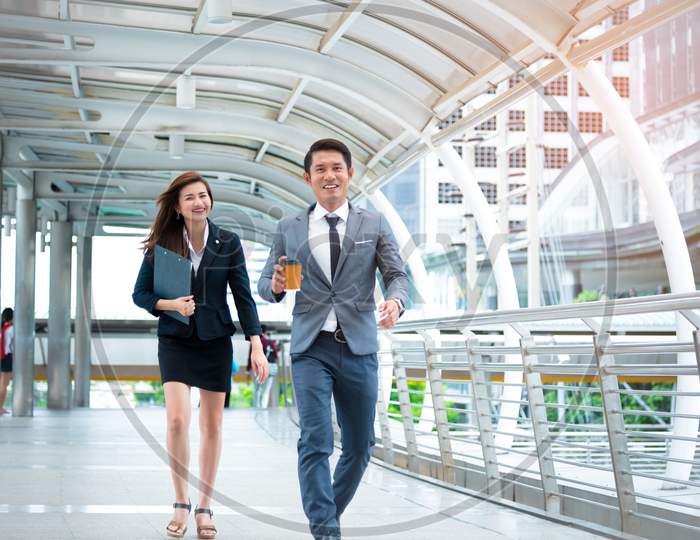 Businessman And Businesswoman Walking With Happiness Mood Face, Happiness Conscept, Business Concept