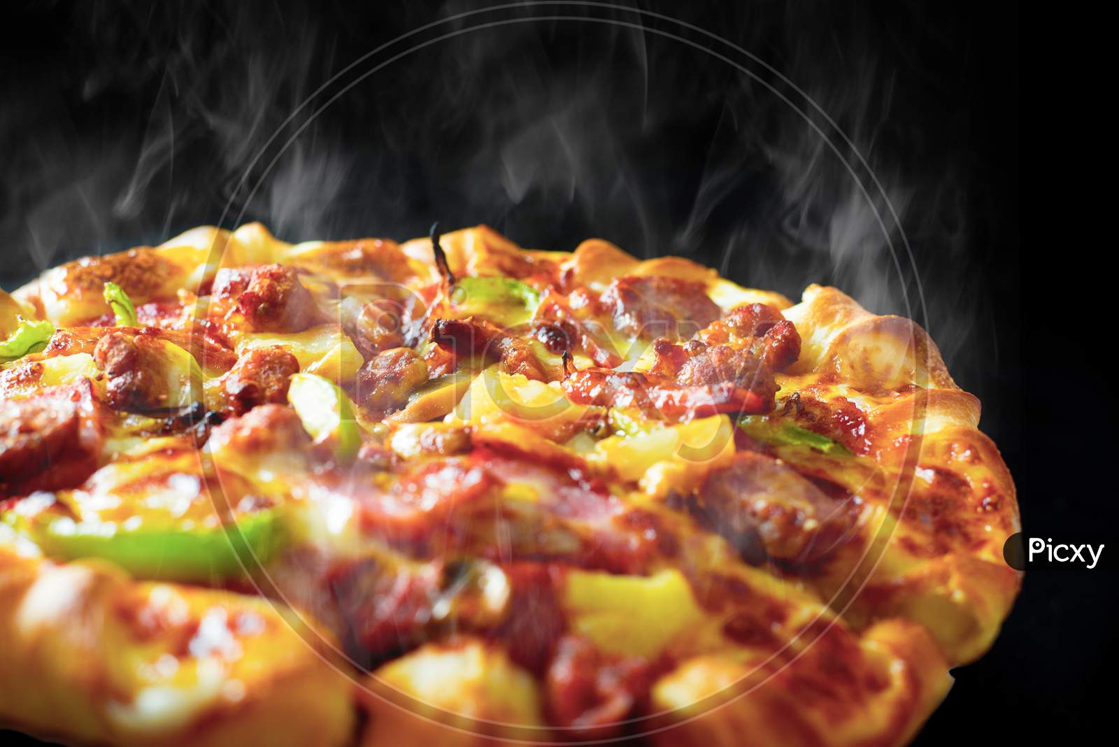 Pizza With Cheese Ham Bacon And Pepperoni On Isolated Black Background With Hot Steaming Smoke. Food And Cooking Concept. Lunch Time Serve And Hungry Theme. Pizza Delivery Service To Home Advertising