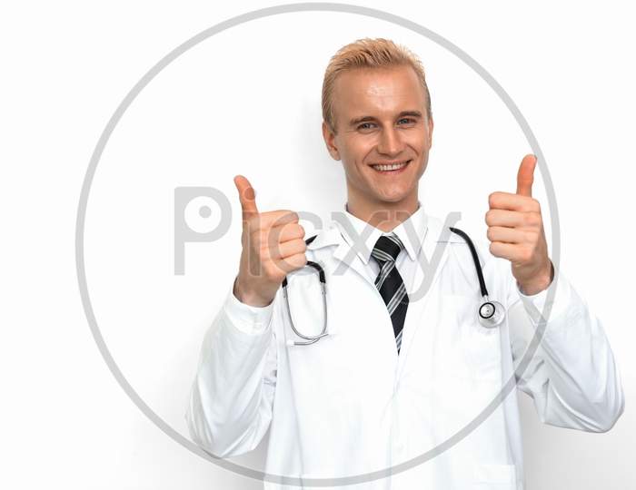Doctor With Stethoscope Show Off Thumbs Up Or Very Good Sign By His Two Hands On The White Background. Medical And Healthcare Concept. Hospital Theme