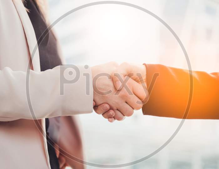 Business People Hand Shake For Dealing With New Project. Business And People Concept. Contact Agreement And Job Application Theme. City And Urban Theme.
