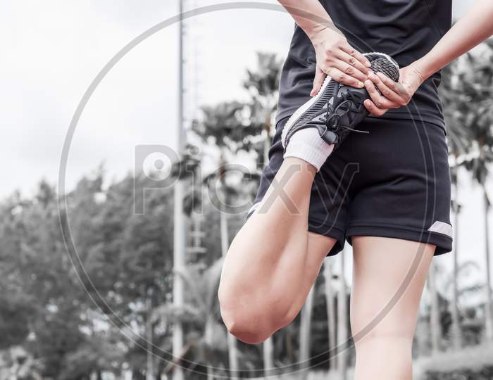Runner Stretching Warm Up Before Exercise, Sport And Activity Concept