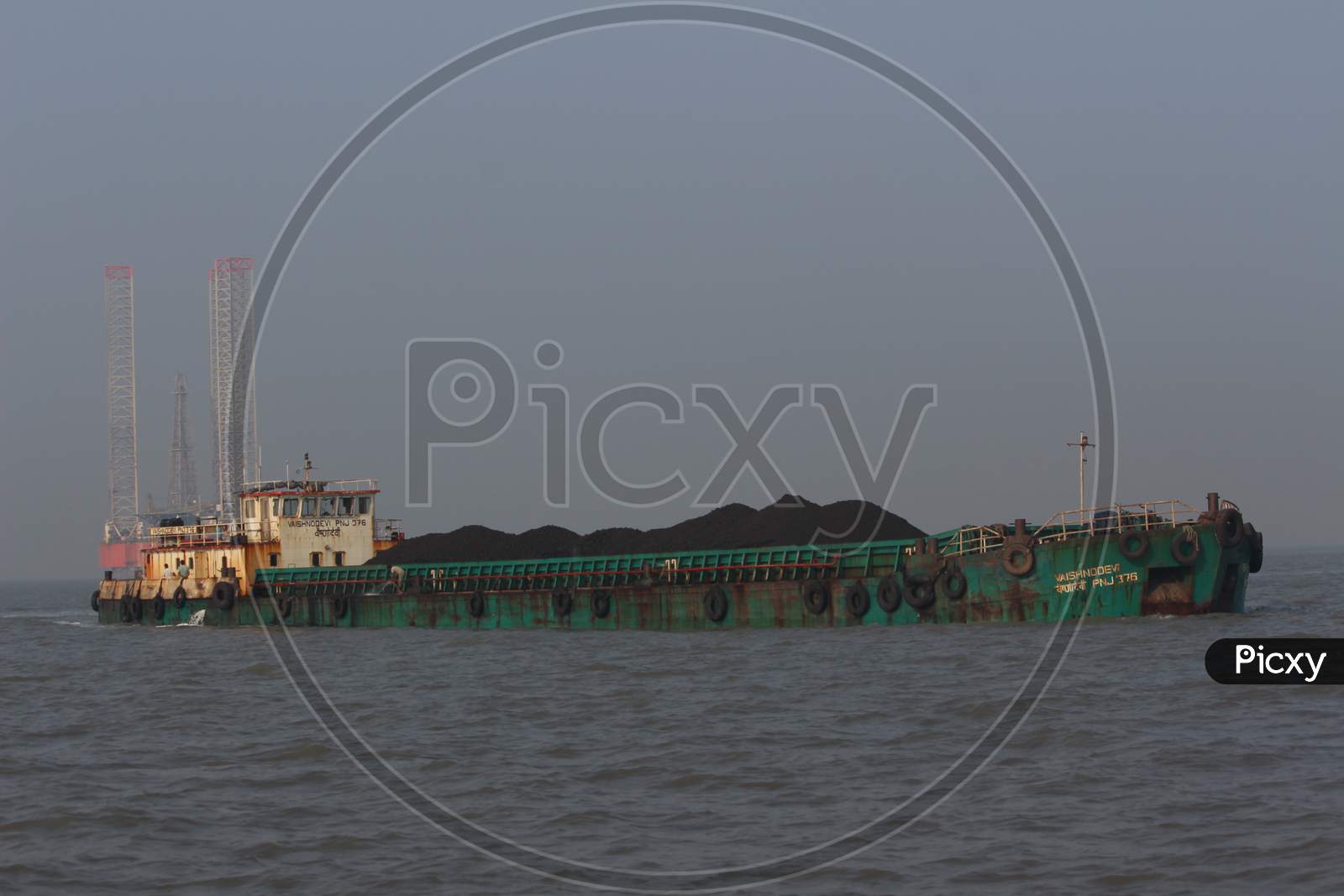 Coal transport ship on Mumbai shore