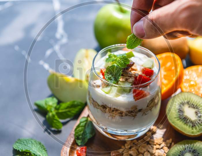 Closeup Nutrition Yogurt With Many Fruits On Table And Chef Hand. Food Cuisine And Drinks Concept. Organic Dessert Theme.