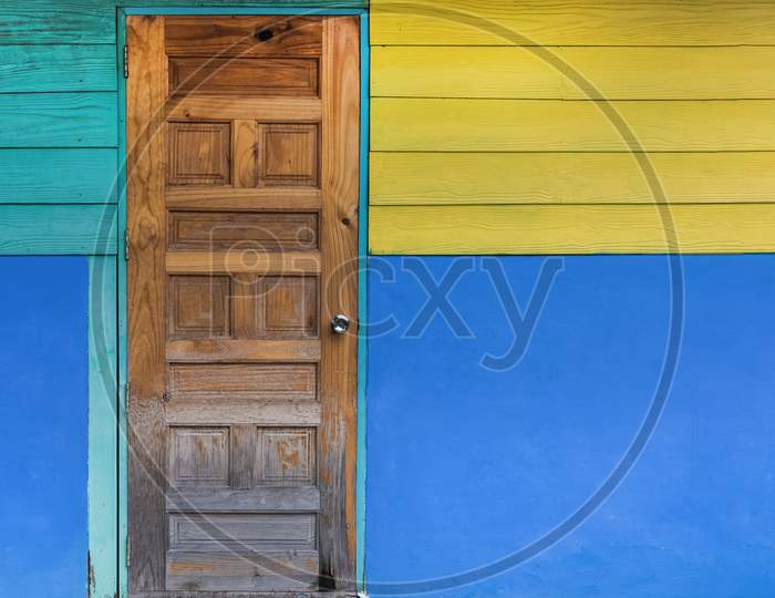 Grunge Old Door With Color Painted Wall. Classical Vintage And Modern Interior Concept. Architecture And Home Design Theme.