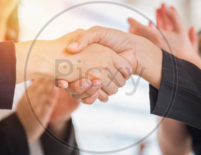 Business People Shaking Hands After Finish Reach Agreement For Startup New Project. Negotiating And Happy Working Concept. Handshake Gesturing Connection Deal Concept. People And Teamwork Theme