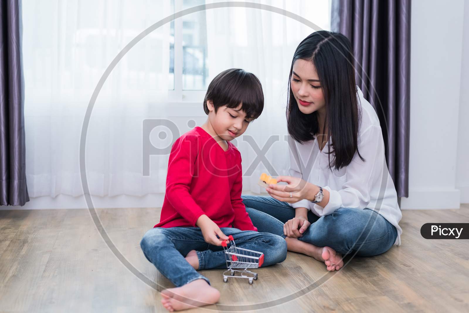 Image of Mom Playing With Son In Home. Teacher And Her Student Playing  Together In Daycare Nursery. Education And Back To School Concept. Happy  Family And Loving Of People Theme-ZL174171-Picxy