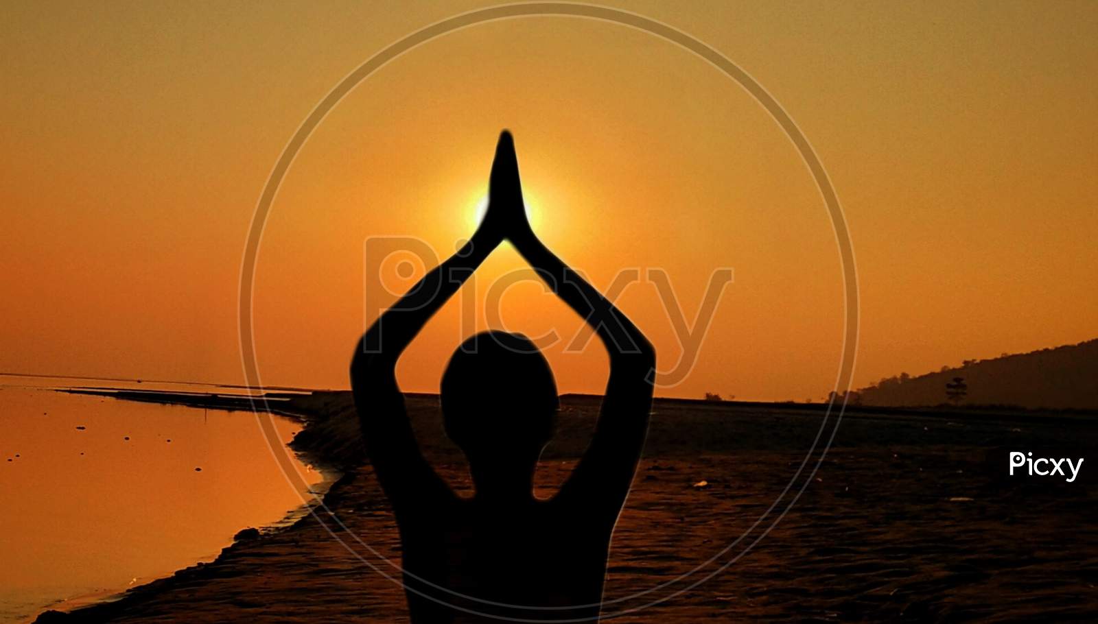 Yoga, silhouette woman doing yoga practice or exercise in the sunset Sky background, international yoga day concept
