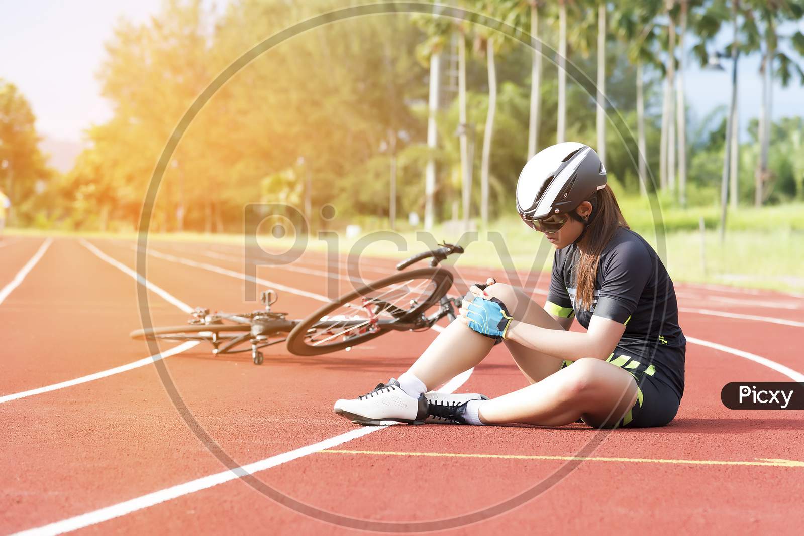 Girl Has Sport Accident Injury At Her Knee From Bicycle, Sport And Accident Concept