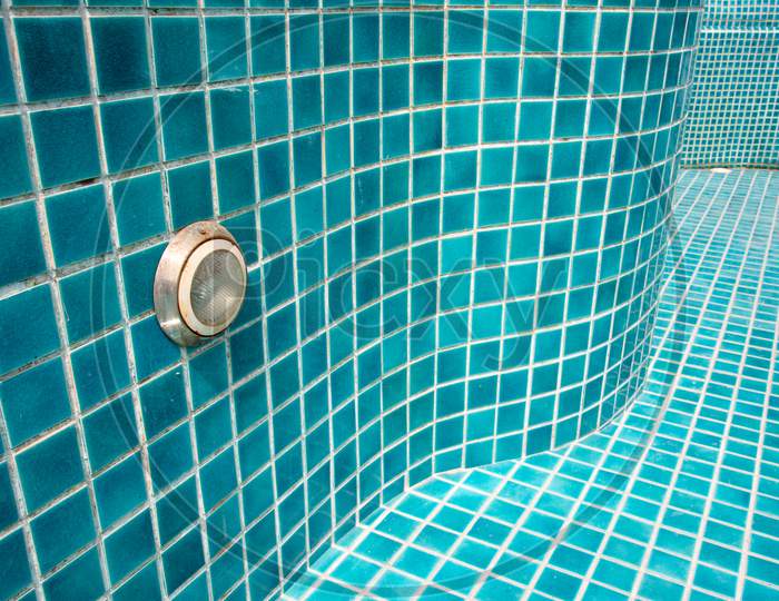 Close Up Of Blue Swimming Pool Tiled Floor. Architect And Construction Concept. Material And Design Concept. Interior And Exterior Theme. Perspective View Angle.