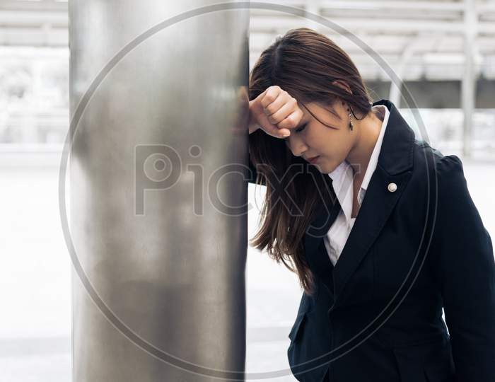 Asian Business Woman Tired From Overworked And Being Heart Attack When Going Home After Overtime Working. Lack Of Sleeping And Healthcare Concept. Health And Stress Of Business Salary Employee