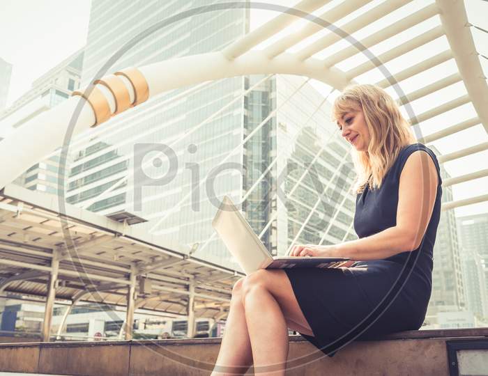 Businesswoman Working With Laptop.  Successful And Happiness Concept. Technology And Lifestyle Concept City And Urban Theme. Happy Life At Outdoors Theme