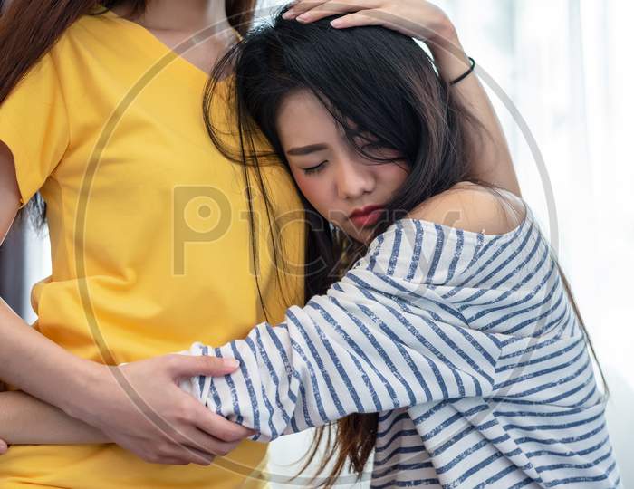 Asian Beauty Sad Girl Was Comforted By A Girl Friend. People And Social Issues Problem Concept. Lifestyle And Friendships Theme. Lesbian And Family Theme.