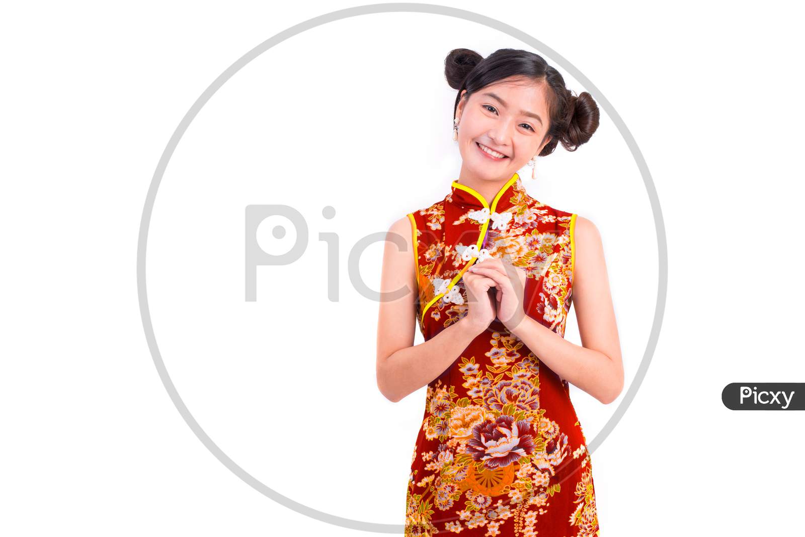 Young Asian Beauty Woman Wearing Cheongsam And Blessing Or Greeting Gesture In Chinese New Year Festival Event On Isolated White Background. Holiday And Lifestyle Concept. Qipao Dress Wearing