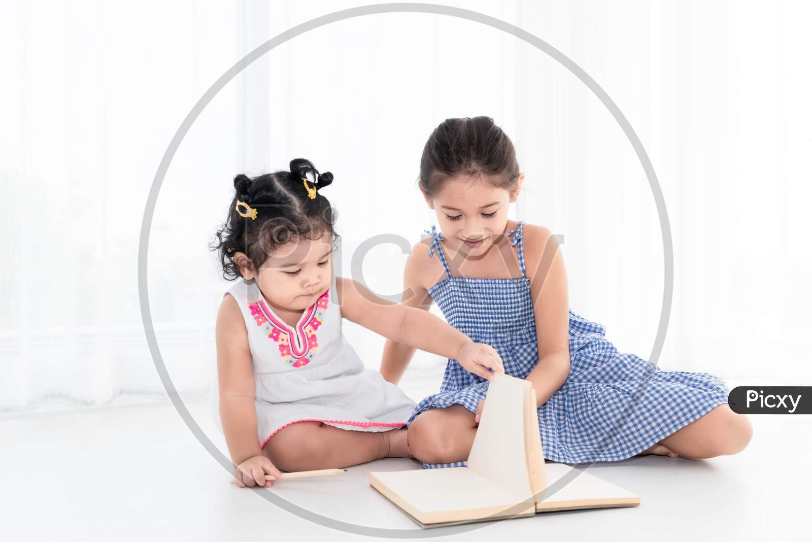 Happy Two Sister Drawing In Sketch Book Together At Home Or Nursery. People Lifestyle And Kids Play. Education And Children Concept. Diverse Ethnicity And Ages. Back To School Theme
