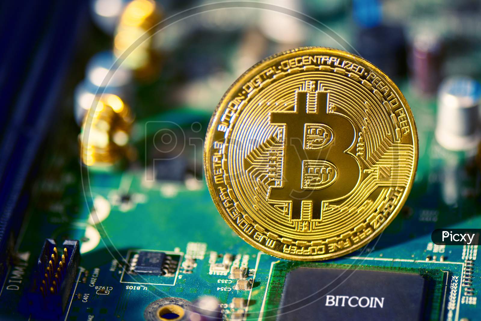Bitcoin On Electronic Circuit Board. Cryptography And Electronic Money Concept. Currency Trading And Gold Mining Theme. Business And Technology Theme.