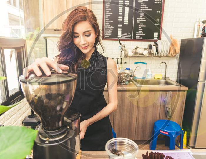 Asian Coffee Maker Woman Making Coffee In Coffee Shop. Beauty And Business Owner Concept. Shop Keeper And Customer Concept. Coffee Shop And Restaurant Theme. Happiness Of Part Time Job And Occupation