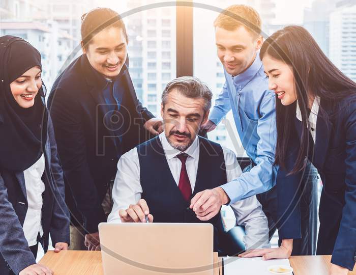 Group Of Multiethnic Business People Training By Executive Senior Boss In Modern Office With Laptop Computer. Startup Team Meeting And Brainstorming, Working People Having Conference Workshop Concept