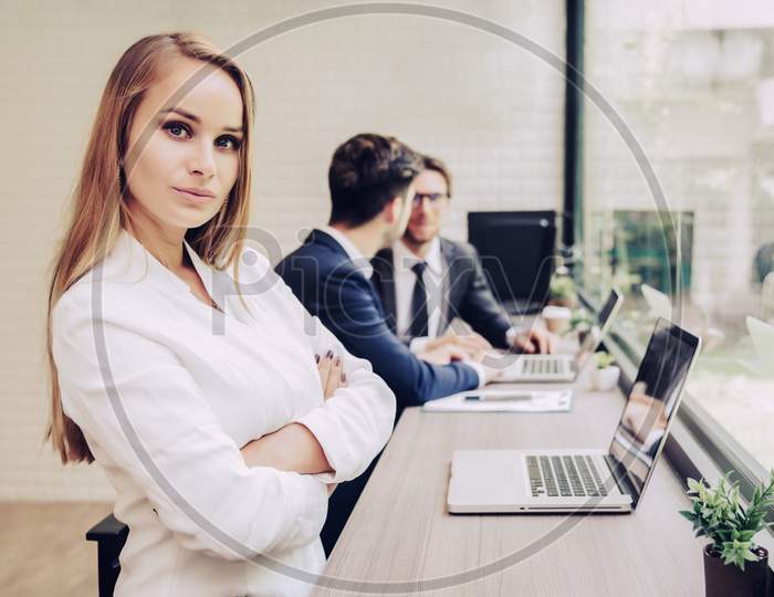 Business Woman Working With Business Team By Laptop Computer. Beauty And Technology Concept. Smart Lady And Working Woman Theme. Office And Happy Life Theme.