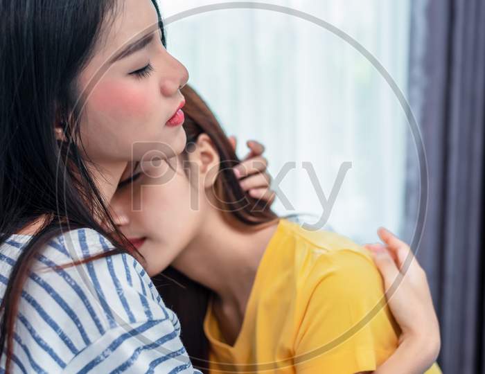Close Up Of Two Asian Lesbian Women Embracing Together In Bedroom. Couple People And Beauty Concept. Happy Lifestyles And Home Sweet Home Theme. Embracing Of Homosexual. Love Scene Making Of Female