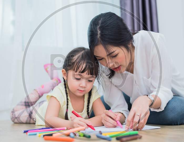 Mom Teaching Her Daughter To Drawing In Art Class. Back To School And Education Concept. Children And Kids Theme. Home Sweet Home Theme.