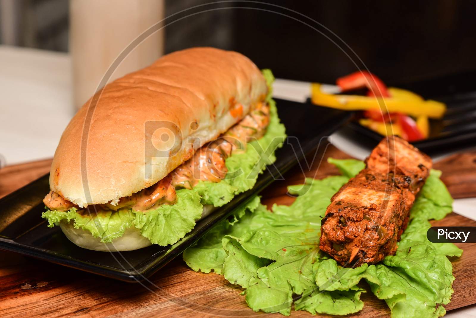 Veg sandwich served with paneer tikka at an Indian restaurant