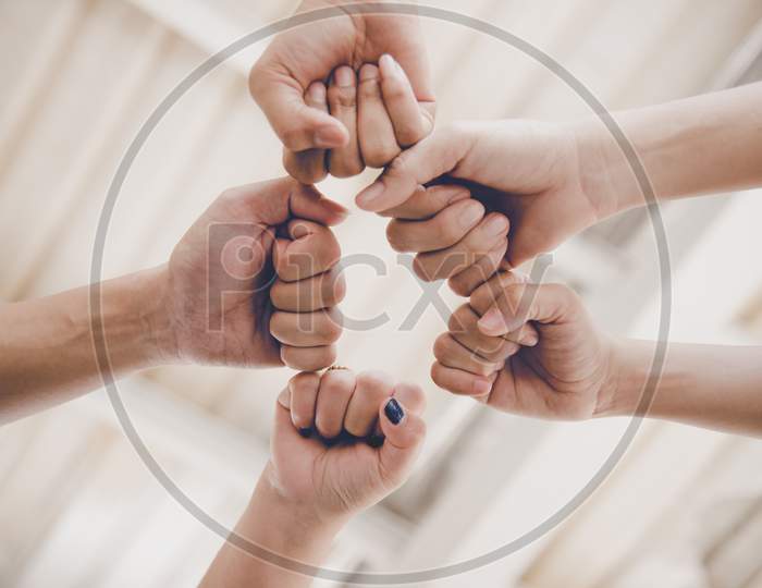 Business Partnership Giving Fist Bump To Start Up New Project. Business And Teamwork Of Partnership Concept. Corporation Meeting In Company Or Industrial Work Concept. Selective Focus On Hand