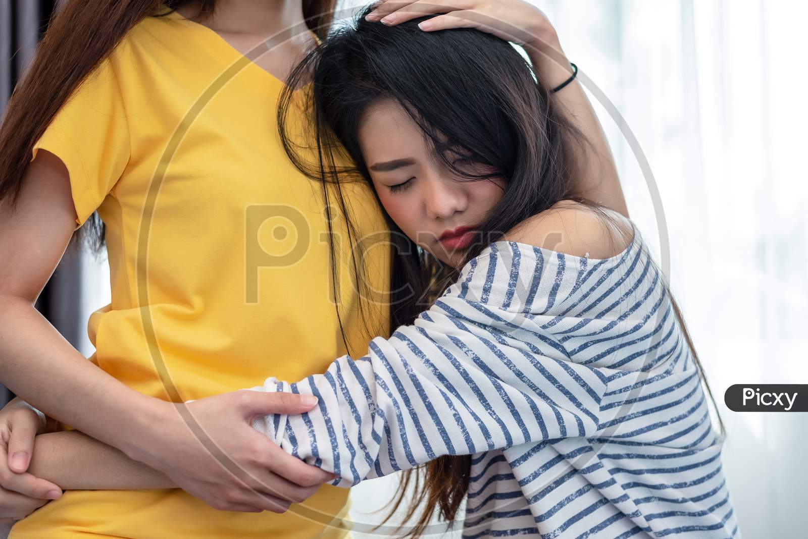 Asian Beauty Sad Girl Was Comforted By A Girl Friend. People And Social Issues Problem Concept. Lifestyle And Friendships Theme. Lesbian And Family Theme.