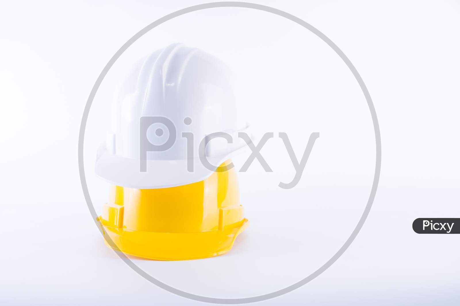 White And Yellow Safety Helmet On White Background. Hard Hat And Thick Gloves On White Isolated Background. Safety Equipment Concept. Worker And Industrial Theme.