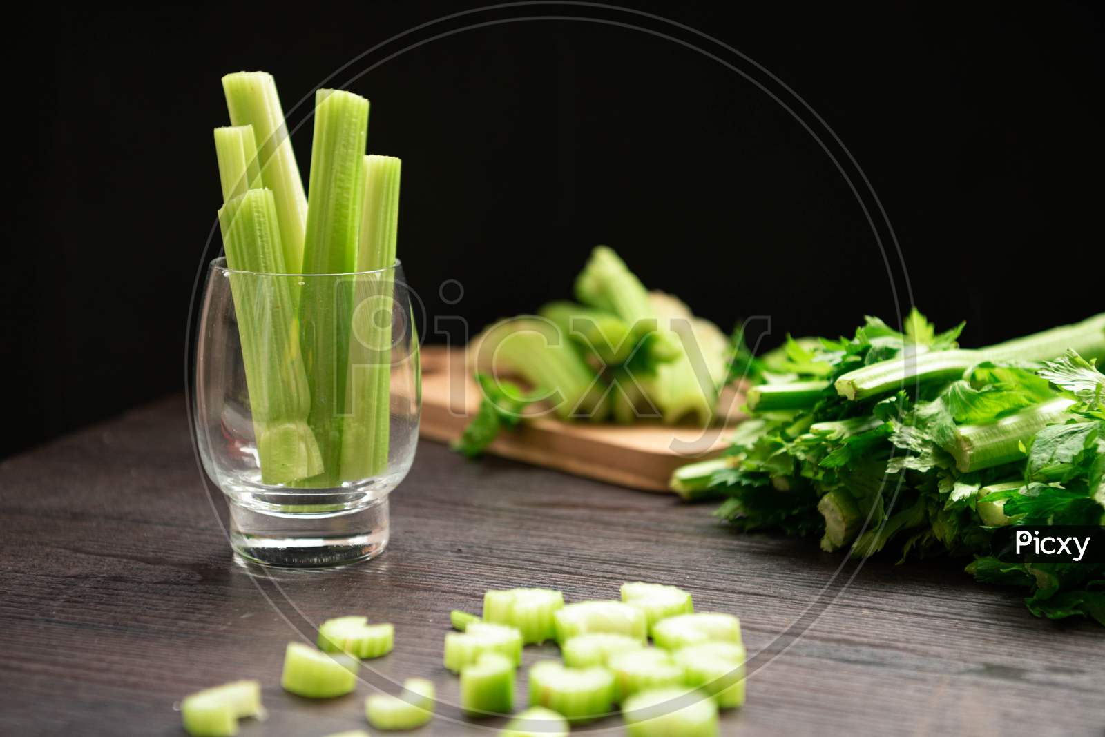 Bunch Of Fresh Celery Stalk On Wooden Table With Leaves Prepared For Making Juice. Food And Ingredients  Of Healthy Vegetable. Freshness Herbal And Low Calories For Dieting With Plenty Of Vitamin
