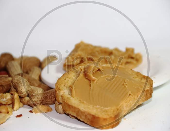 Toast With Peanut Butter On White Background