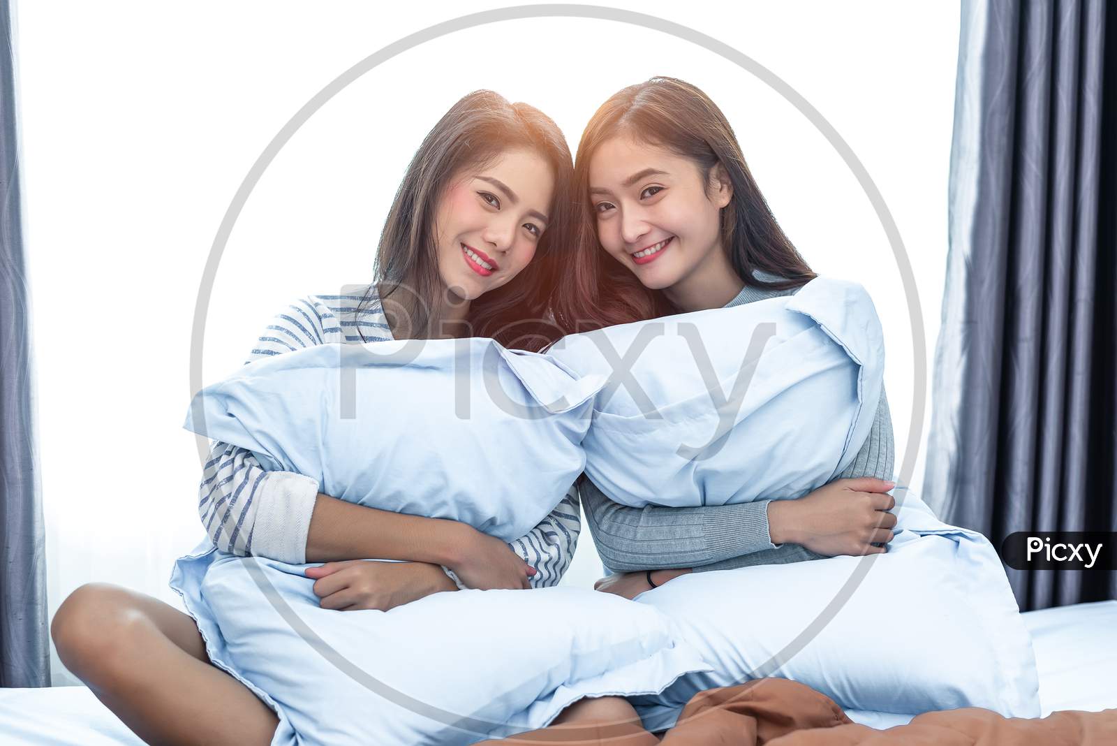 Two Asian Lesbian In Bedroom. Beauty Concept. Happy Lifestyles And Home Sweet Home Theme. Cushion Pillow Element And Window Background.