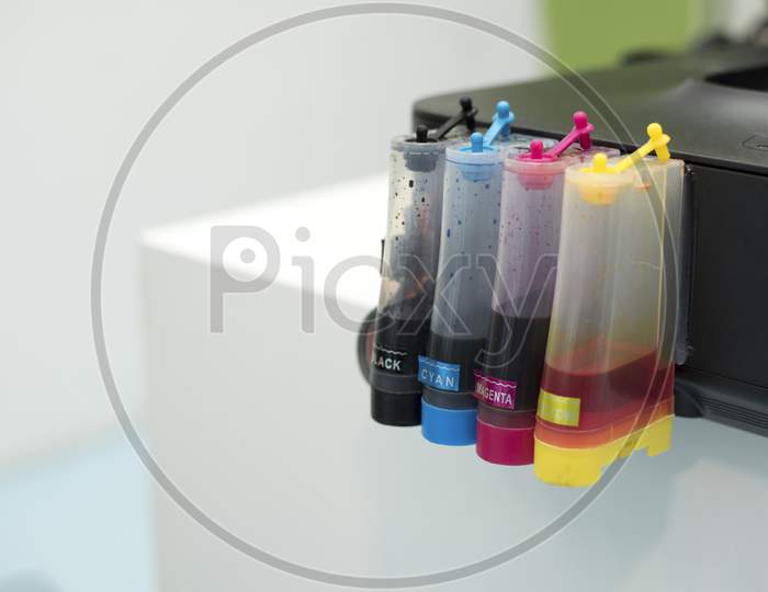 Printer Ink Jet Tank. Computer And Color Concept. Technology Accessories And Equipment Theme. Office And Workplace Theme.
