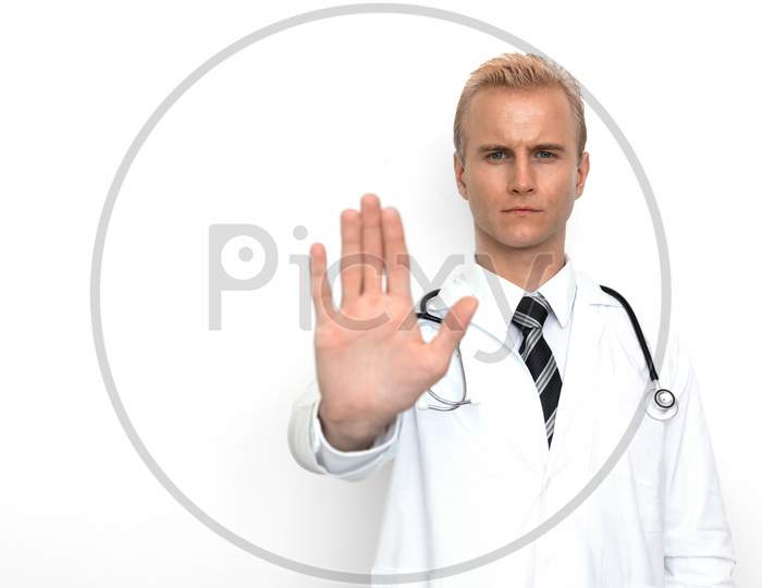 Doctor With Stethoscope Show Off "Stop" Or "Not Allowed" Sign By His Hand On The White Background. Medical And Healthcare Concept. Hospital Theme