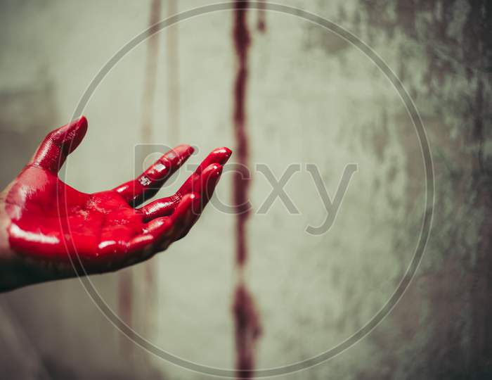 Close Up Of Bloody Hands In Abandon House Background. Horror And Ghost Concept. Criminal And Murder Concept. Halloween Day And Sacrifice Theme. People And Religion Theme. Open The Palm Of The Hands.