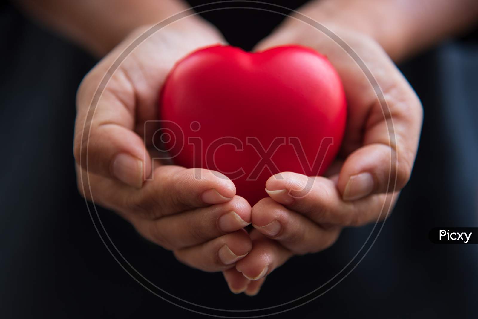 Close Up Hands Giving Red Heart As Heart Donor. Valentine Day Of Love Concept. Medical Ventilator And Heart Donator Charity. Sign Of Compassion And Healthy. Helping Hand In Freedom Life Donation