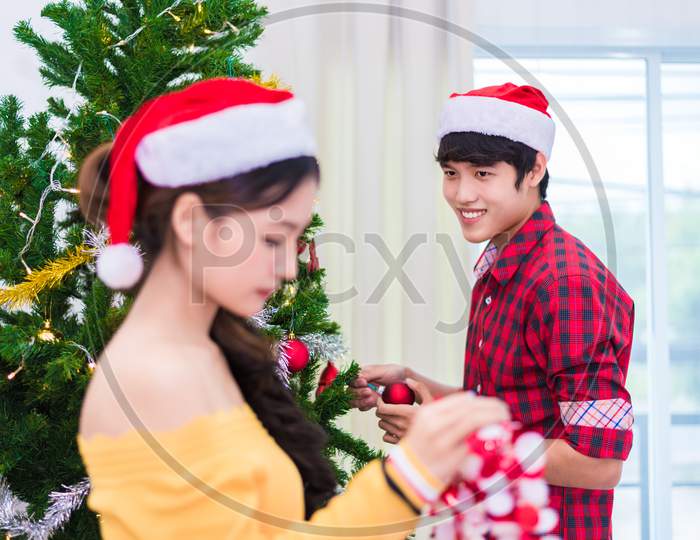 First Impression Of Man To Woman Who Prepare To Decorating Christmas Tree In New Year Festival. Xmas And Event Concept. Love Of Lovers And Couples Concept. Bed Room And Living Room Theme. Fall In Love