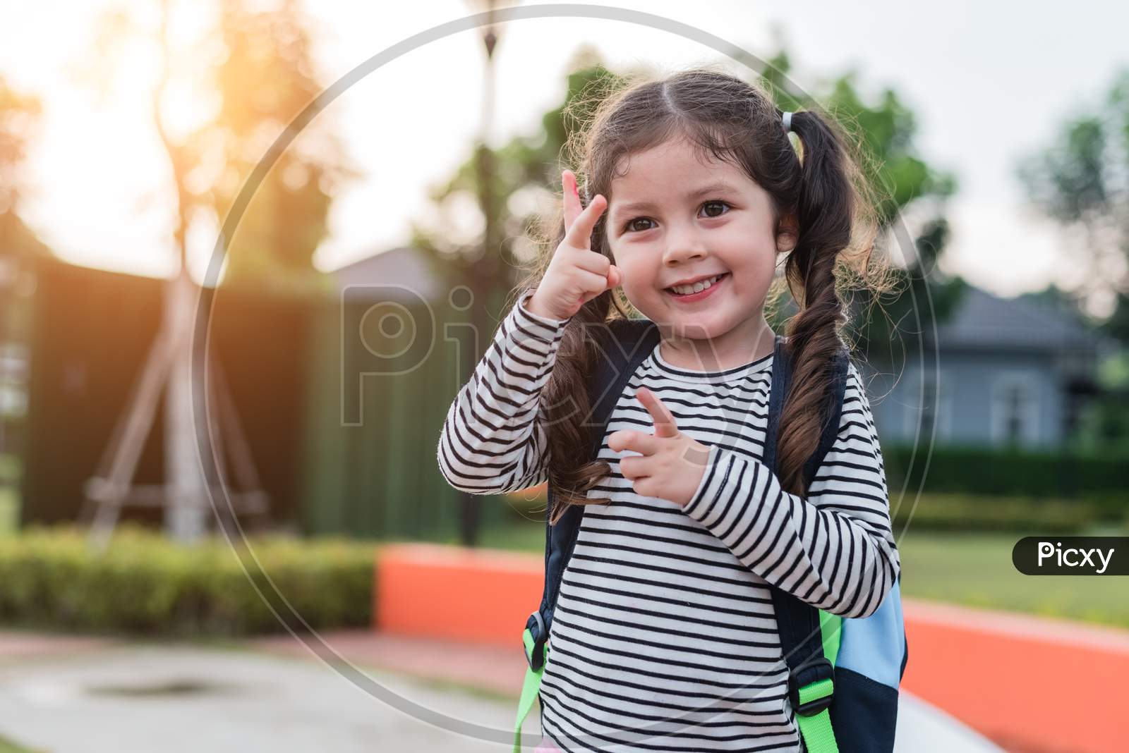 Happy Little Girl Enjoy Going To School. Back To School And Education Concept. Happy Life Family Lifestyle Theme. Cheering Up Gesture