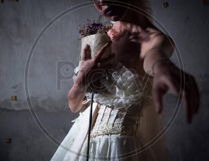 Bride Zombie In Wedding Dress With Dried Flowers Pointing And Want You To Stay With Her In Abandoned House, Halloween Theme, Ghost And Deadman Concept, Heart Broken And Neglected Concept, Dark Tone
