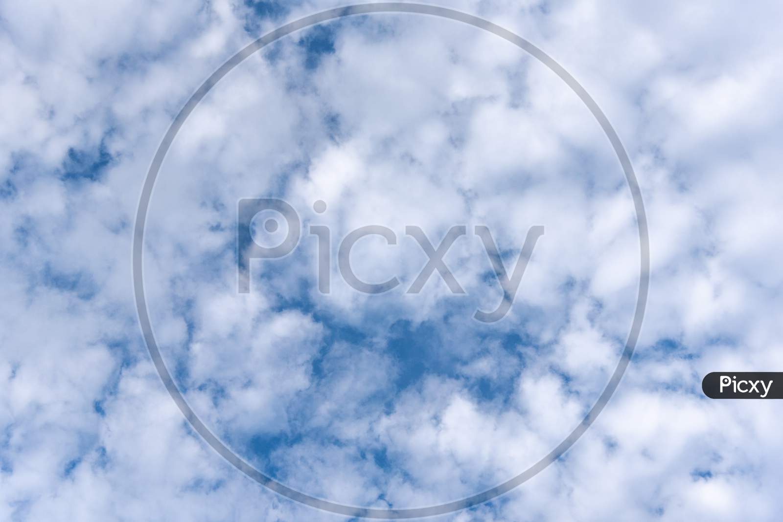 Blue Sky Background With Clouds. Nature And Background Concept. Space And Air Theme.