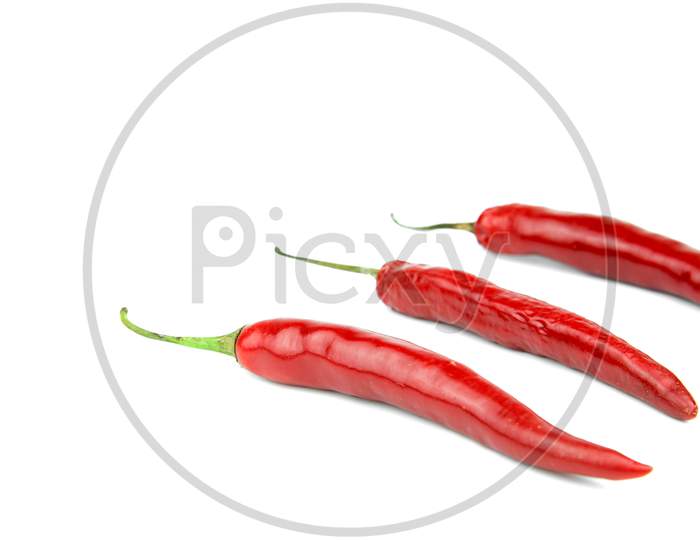 Red Chili On White Background. Food And Vegetable Concept.