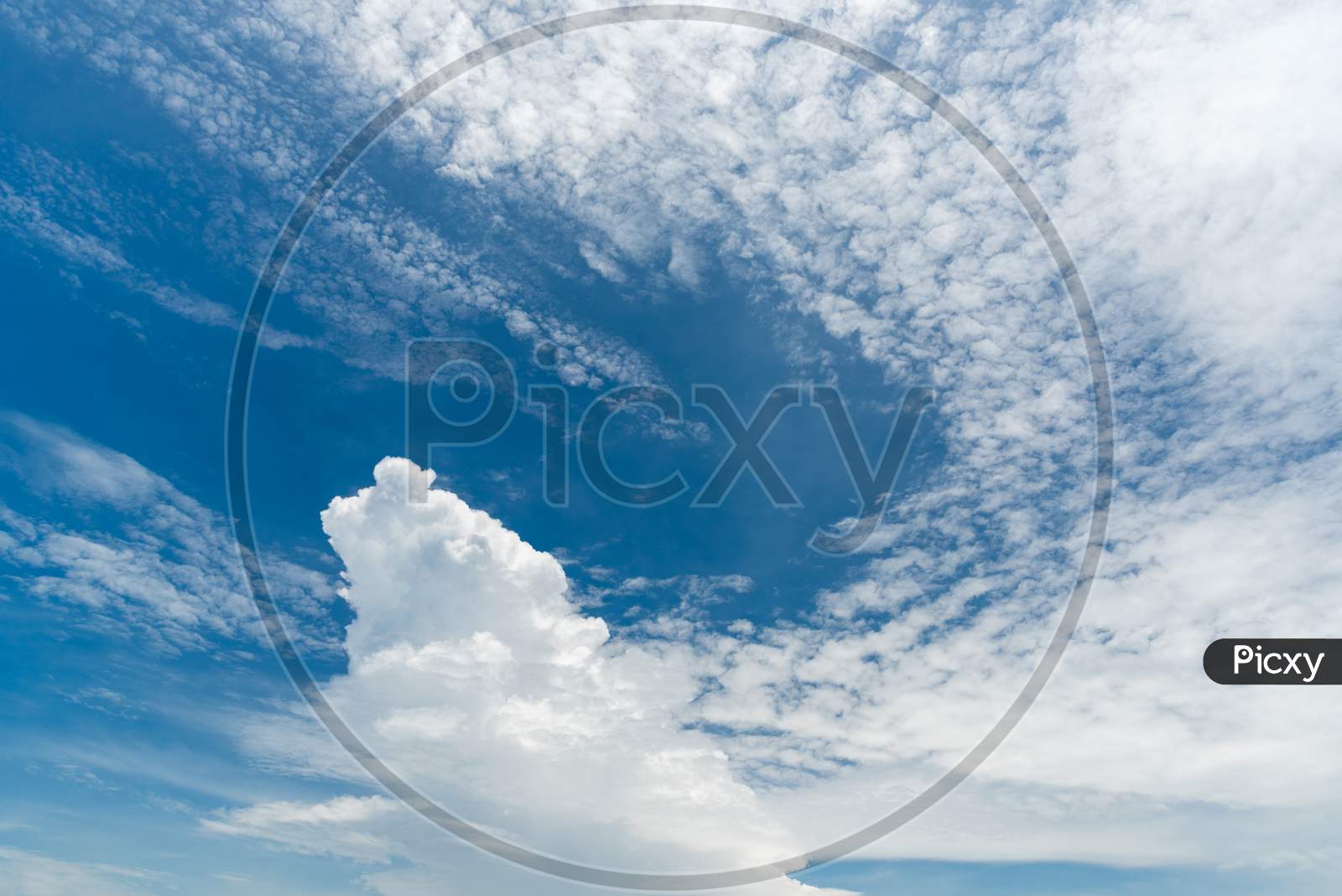 Blue Sky Background With Clouds. Nature And Background Concept. Space And Air Theme.