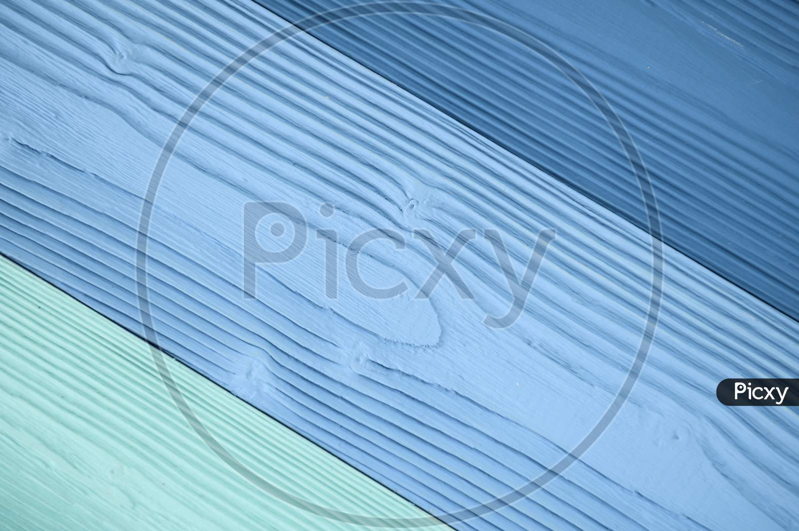Top Diagonal View Of Blue Wooden Textured Background Backdrop. Abstract Wallpaper Pastel Blue Ocean Color