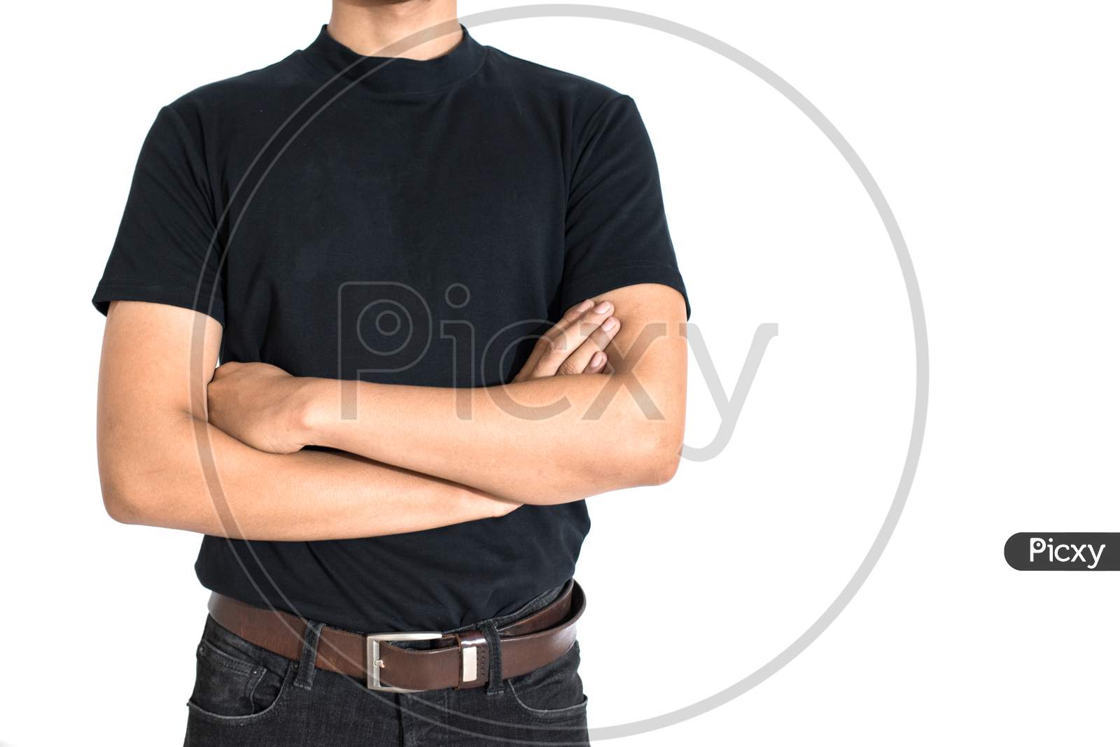Man Standing And Do Arms Crosses On Isolated White Background. Black T-Shirt And Jeans With Brown Belt In Fashion Concept