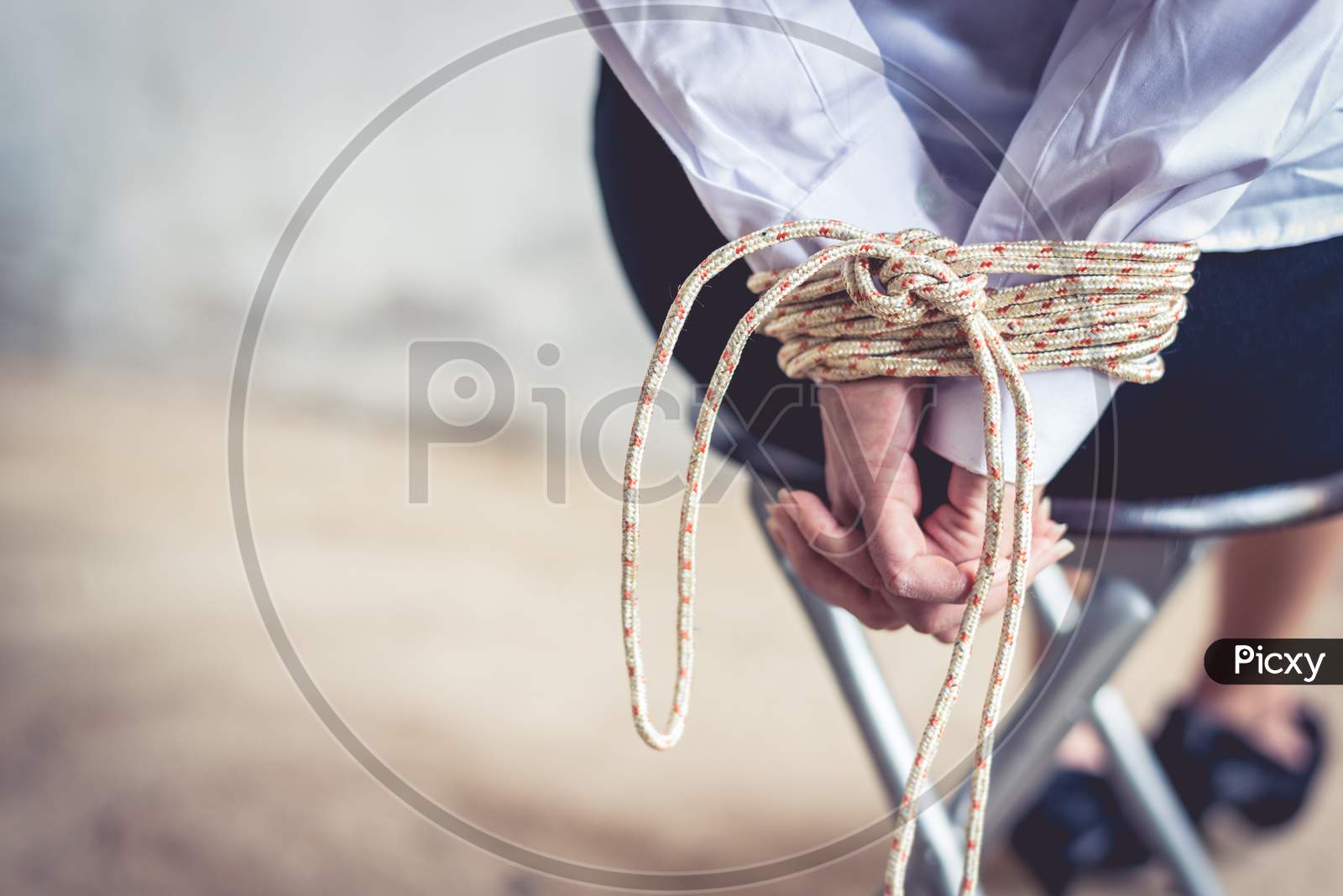 Close Up Of Woman Hand With Tie Rope. Hostage And Ransom Concept. Terrorist And Robber Concept. Submission People Theme