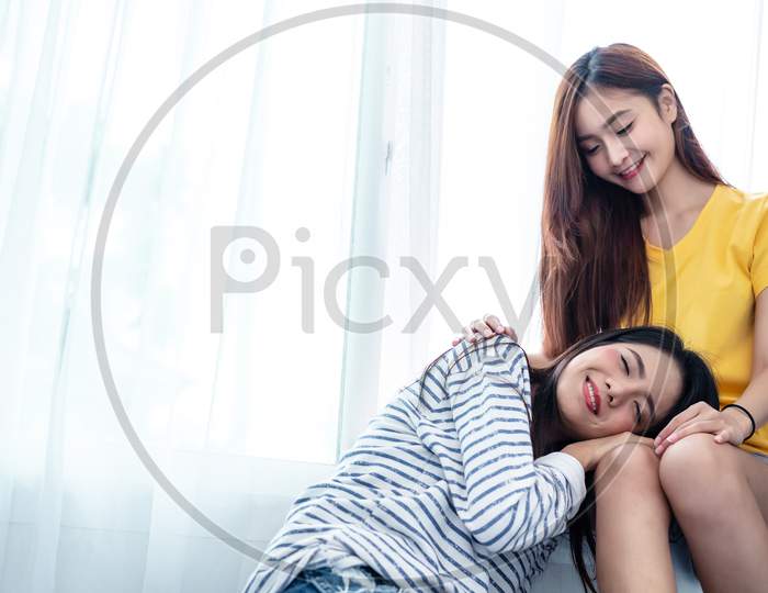 Asian Couple Take Care Together Near White Window With Soft Sunshine In Happiness Moment Together. People And Lifestyles Concept. Lesbian And Friendships Theme. Lgbt Theme.