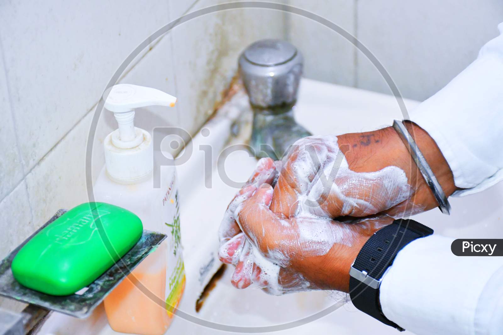 Washing hands rubbing with soap man for corona virus prevention, hygiene to stop spreading coronavirus. India