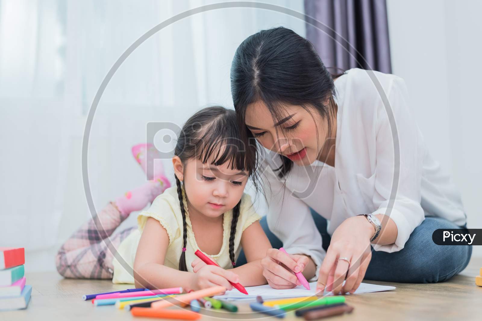 Mom Teaching Her Daughter To Drawing In Art Class. Back To School And Education Concept. Children And Kids Theme. Home Sweet Home Theme.